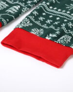 Modern green Christmas pajamas with winter motifs, snowflakes, fir trees