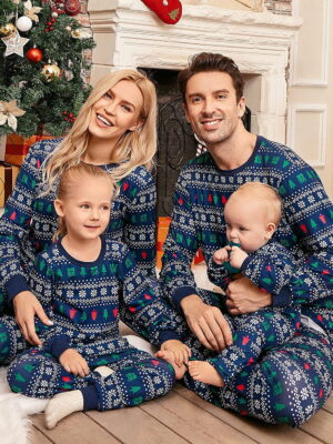 Christmas pyjamas winter modern patterns family dark blue family sitting by a tree